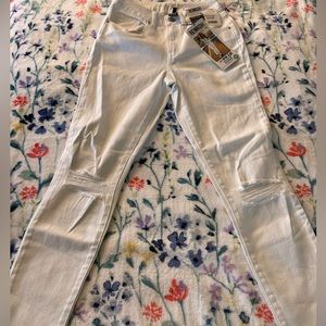 White jeans with rips in the knee size 0